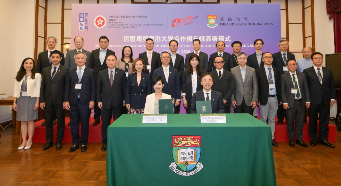 The Secretary for Housing, Ms Winnie Ho (first row, left), and the President and Vice-Chancellor of the University of Hong Kong, Professor Xiang Zhang (first row, right), sign a Memorandum of Understanding today (March 31) to establish a co-operation framework for promoting research and the practical application of innovative construction technologies in public housing development, thereby leading Hong Kong's construction industry to accelerate its transformation towards high-quality, intelligent, and sustainable development.